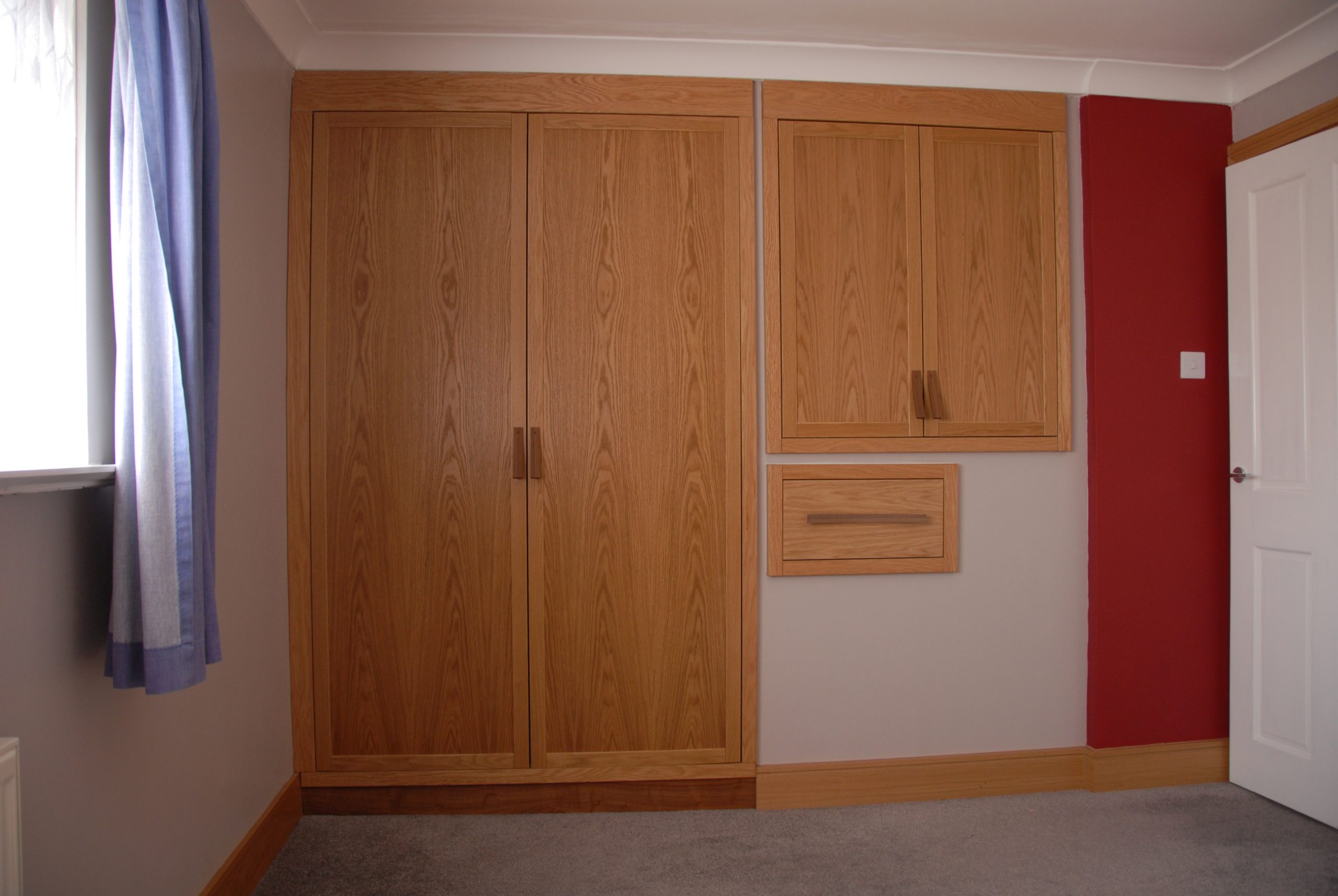 Oak and American black walnut wardrobes. over stairs maximum storage. Laminated curved walnut handles and blum soft close external and internal drawers and a haffel pull down hanging rail.